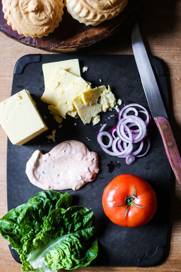 ingredients for burgers on chopping board