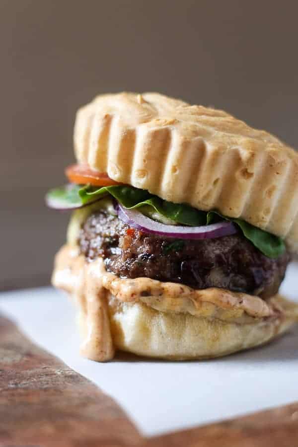 A close up of a burger on a plate