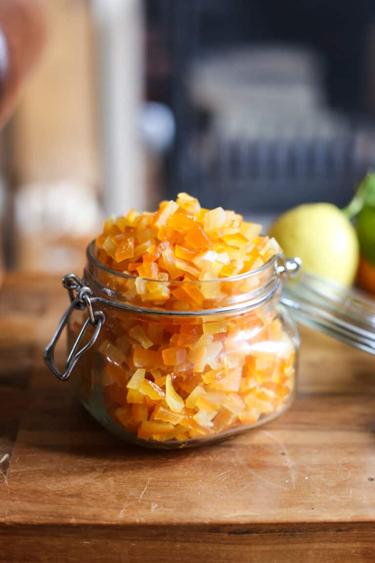 jar of homemade mixed peel on a wooden table