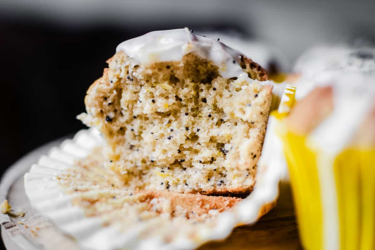 Close up of a split open Lemon and Poppy Seed Muffin