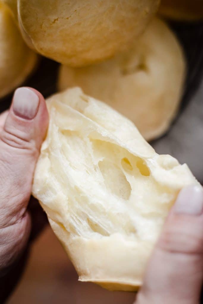 Cheese Roll being pulled apart to show cheesy inside