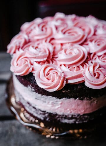 A close up of a raspberry chocolate cake