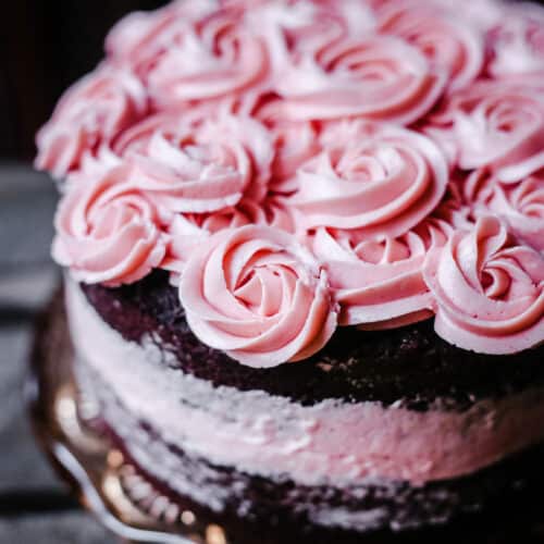 A close up of a raspberry chocolate cake