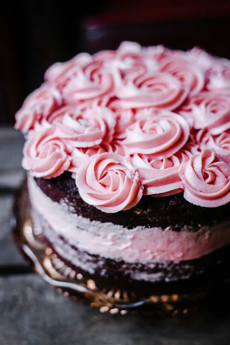 A close up of a raspberry chocolate cake