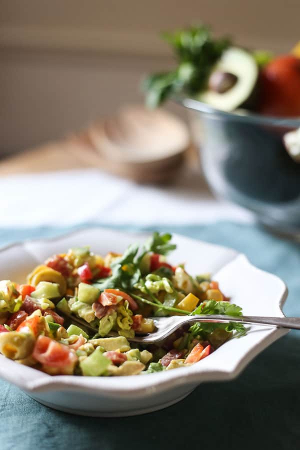 A bowl of salad with a fork