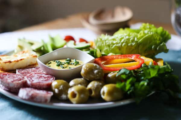 A close up of a plate of salad on a table