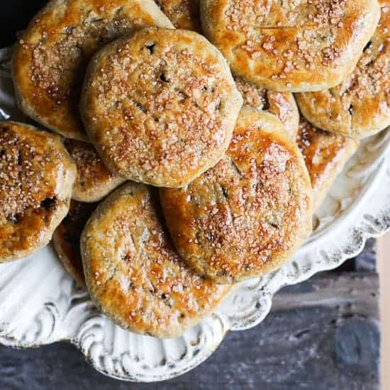 A close up of eccles cakes on a plate