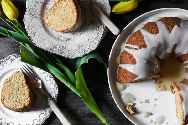 plates of slices of bundt cake on a table with flowers