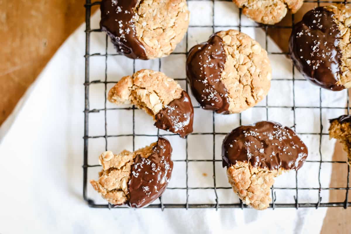 Gluten-Free Chocolate-Dipped Oat Peanut Butter Cookies on a wire rack