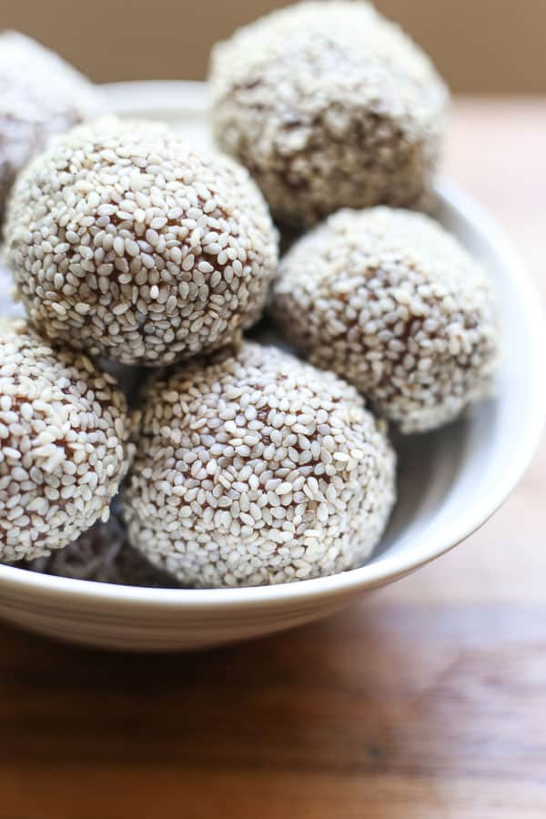 A close up of a bowl of energy balls