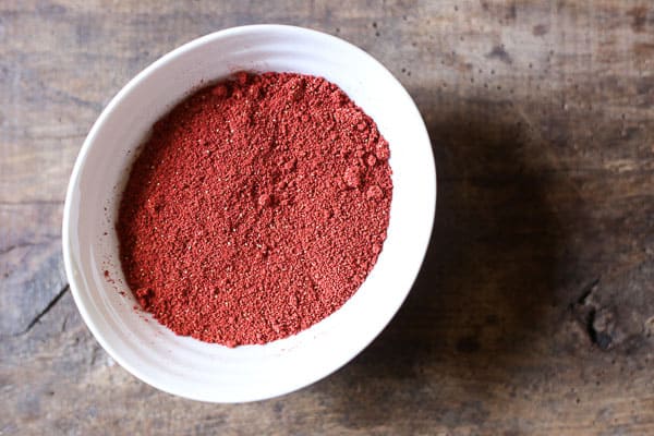 A close up of a bowl of strawberry powder