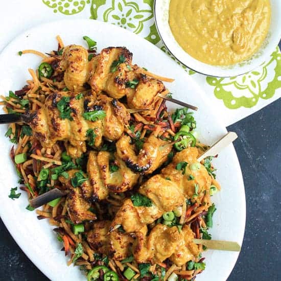 A plate of Cashew Chicken Satay with Carrot and Coriander Salad