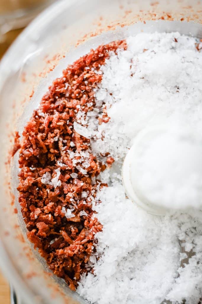 Crumbled bacon and sea salt in a food processor