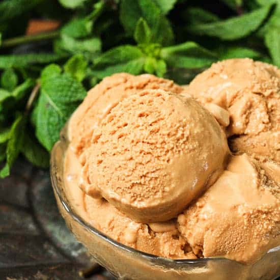 Butter Mint Ice Cream A bowl of Butter Mint Ice Cream in front of some mint leaves