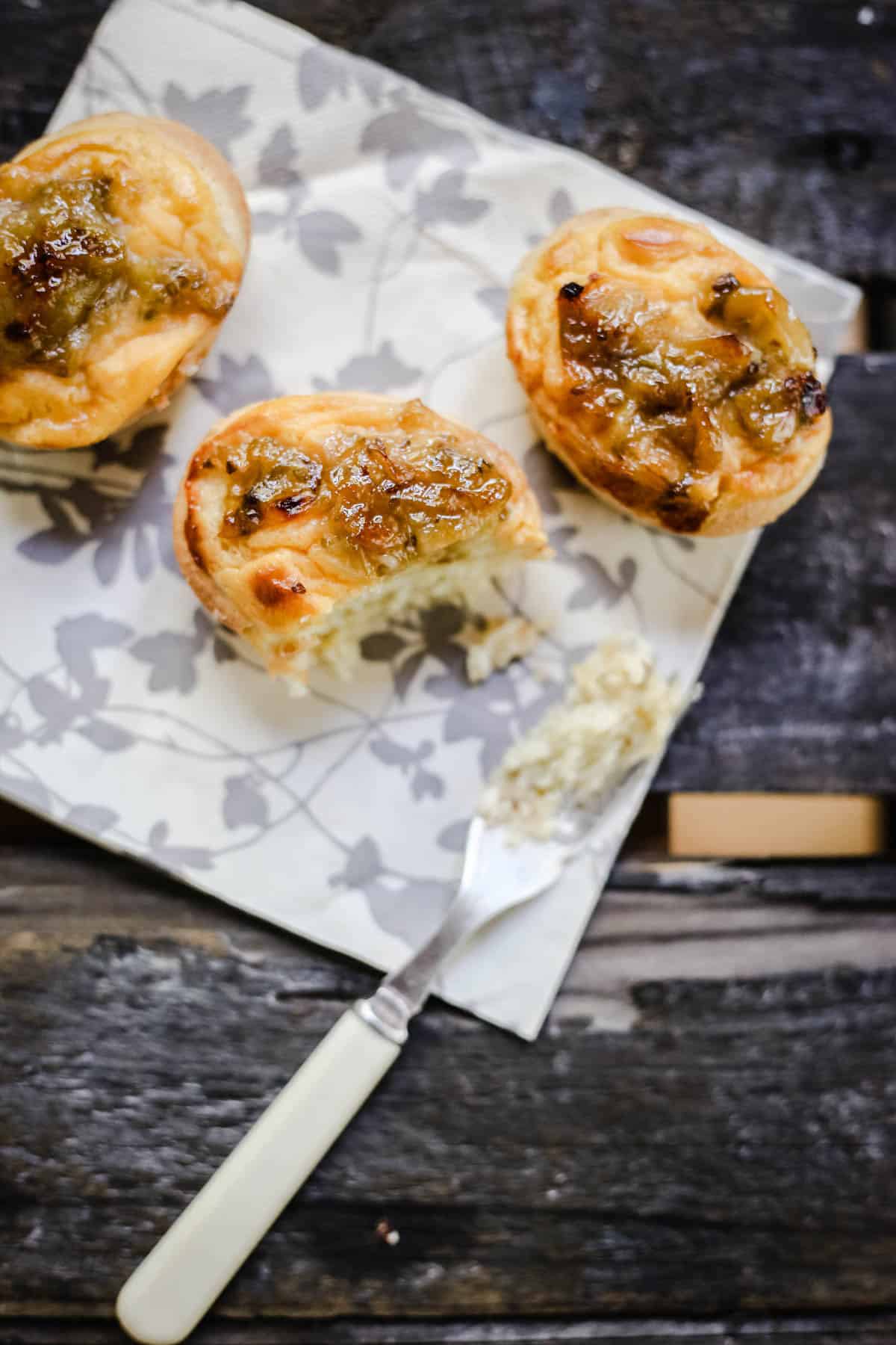 Gooseberry Friands topped with custard and fresh gooseberry jam.