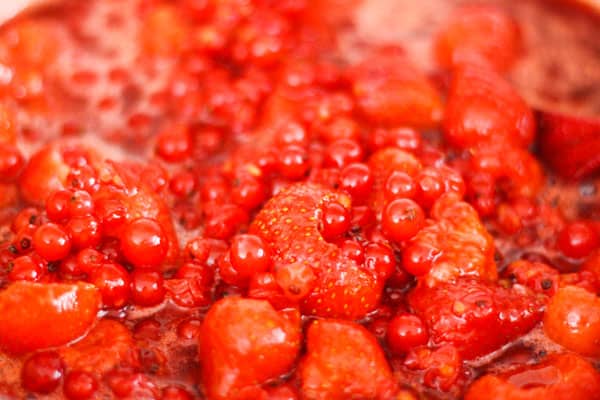 A close up of strawberries and redcurrants