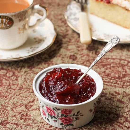 A ramekin of jam on a table