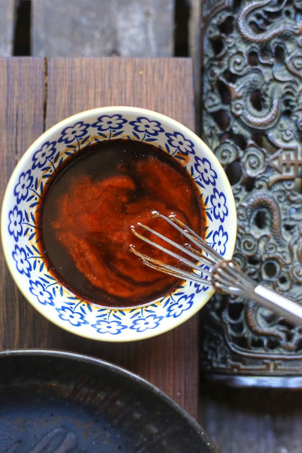 Sriracha Honey Sauce in a bowl with a whisk