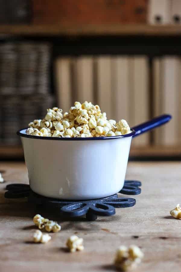 Buttered Maple and Bacon Salt Popcorn in a saucepan on a table