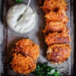 Sweet Potato Rosti with Bacon on a baking tray with dip.