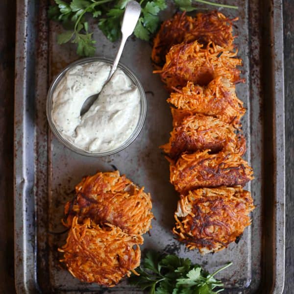Sweet Potato and Bacon Rosti overhead shot of Sweet Potato and Bacon Rosti on a metal tray with tahini sauce