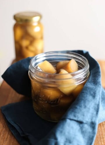 An open jar of Homemade Stem Ginger in Syrup