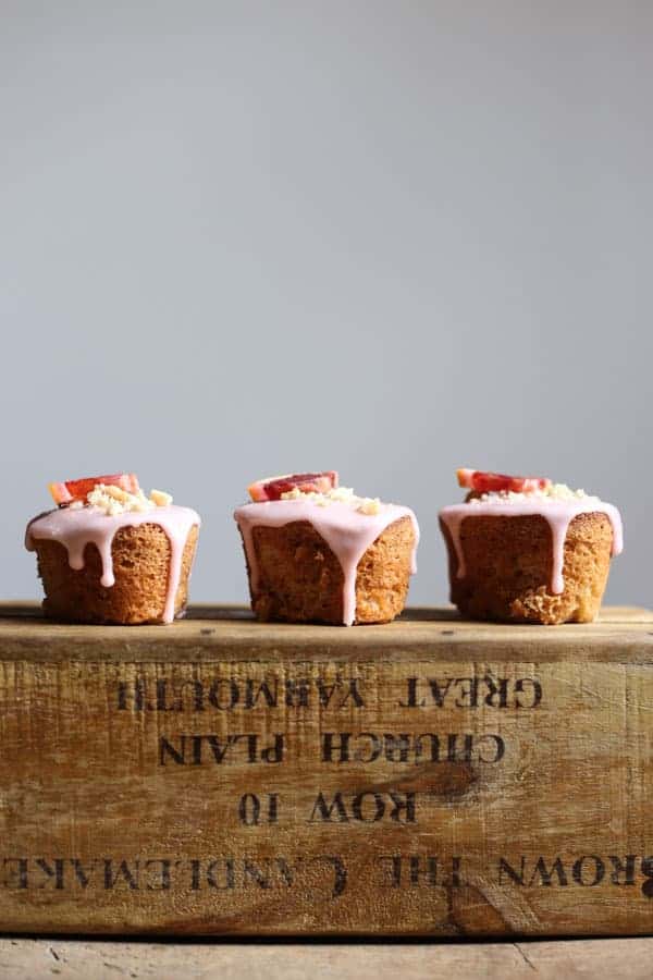 Blood Orange Buckwheat Hazelnut Friands resting on a wooden box