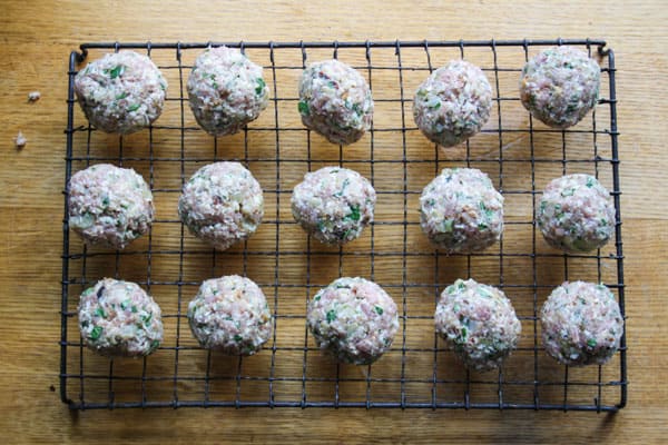 meatballs on a wire rack on a table