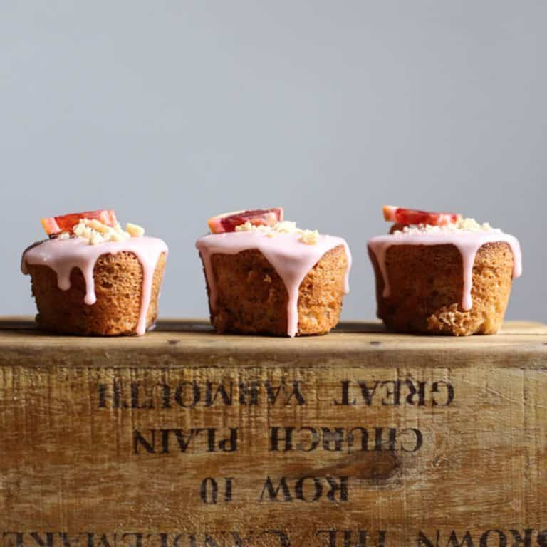 Blood Orange Buckwheat Hazelnut Friands resting on a wooden box