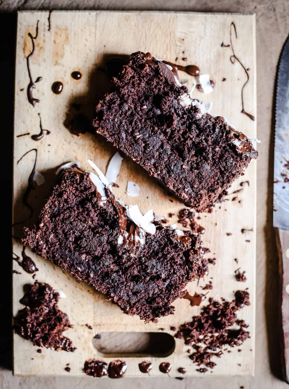 slices of Vegan Chocolate Coconut Banana Bread on a wooden board