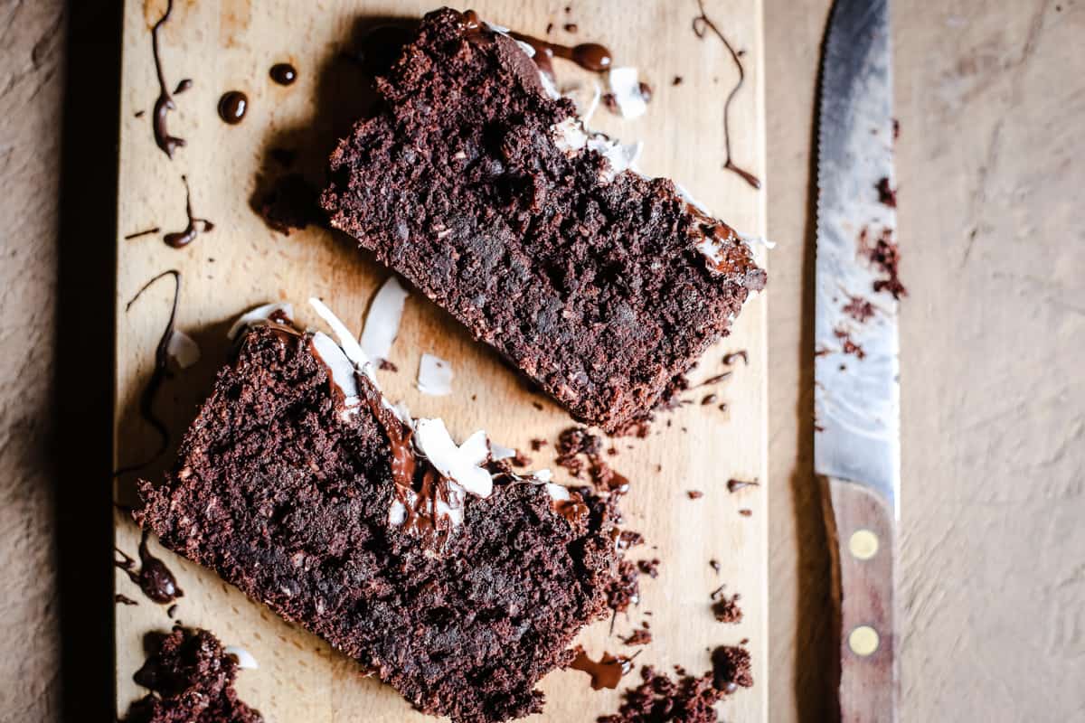 slices of Vegan Chocolate Coconut Banana Loaf on a wooden board