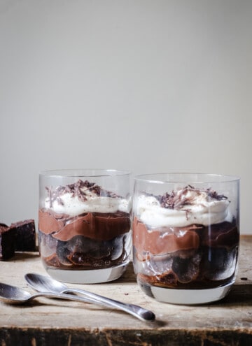 Chocolate Brownie Espresso Trifles on a wooden board with spoons