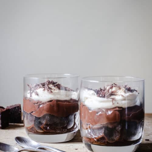 Chocolate Brownie Espresso Trifles on a wooden board with spoons