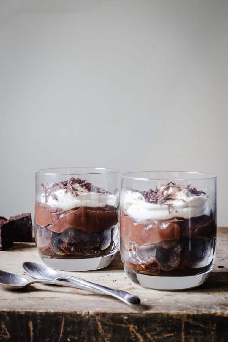 Chocolate Brownie Espresso Trifles on a wooden board with spoons