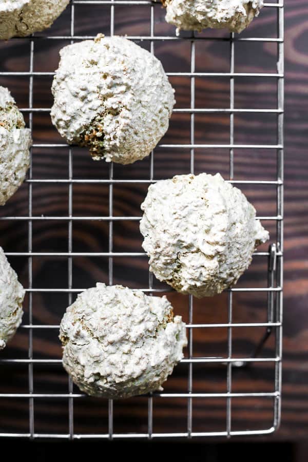 Coconut Matcha Macaroons on a wire rack