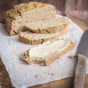 cut open and a slice of gluten-free irish soda bread
