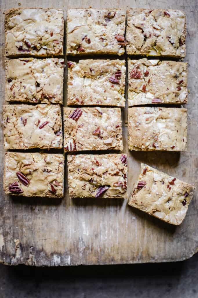 overhead of gluten-free blondies on a wooden board