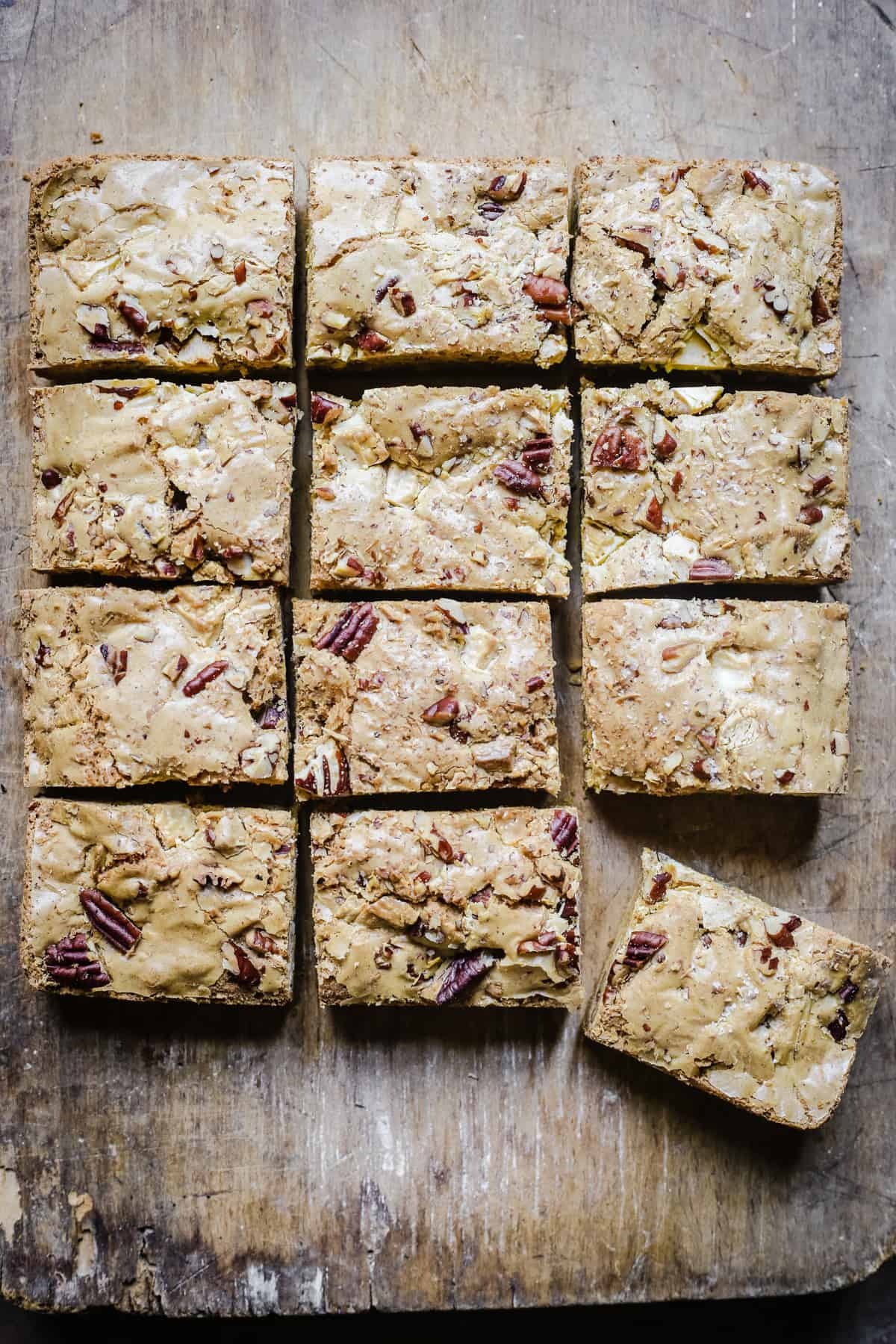 overhead of gluten-free blondies on a wooden board