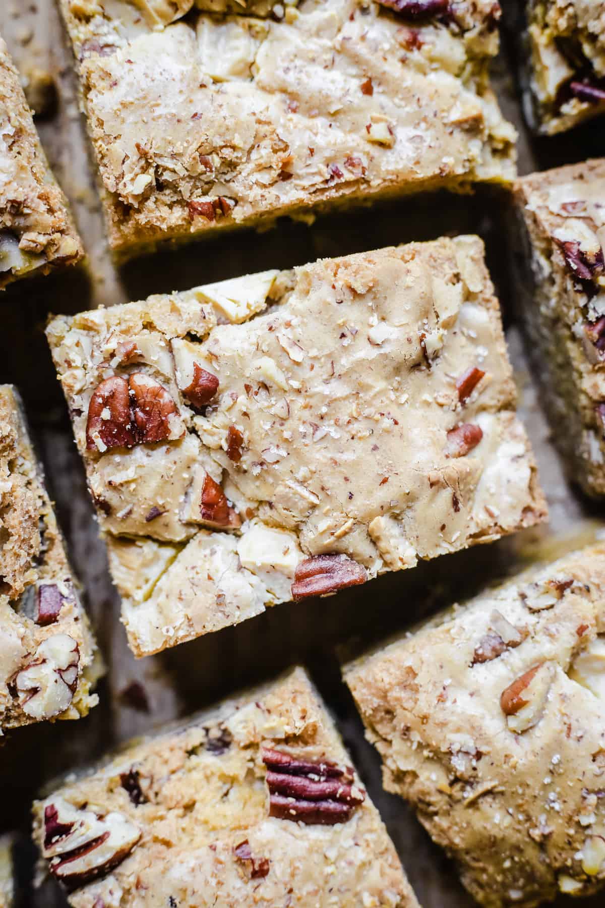 overhead of gluten-free blondies on a wooden board