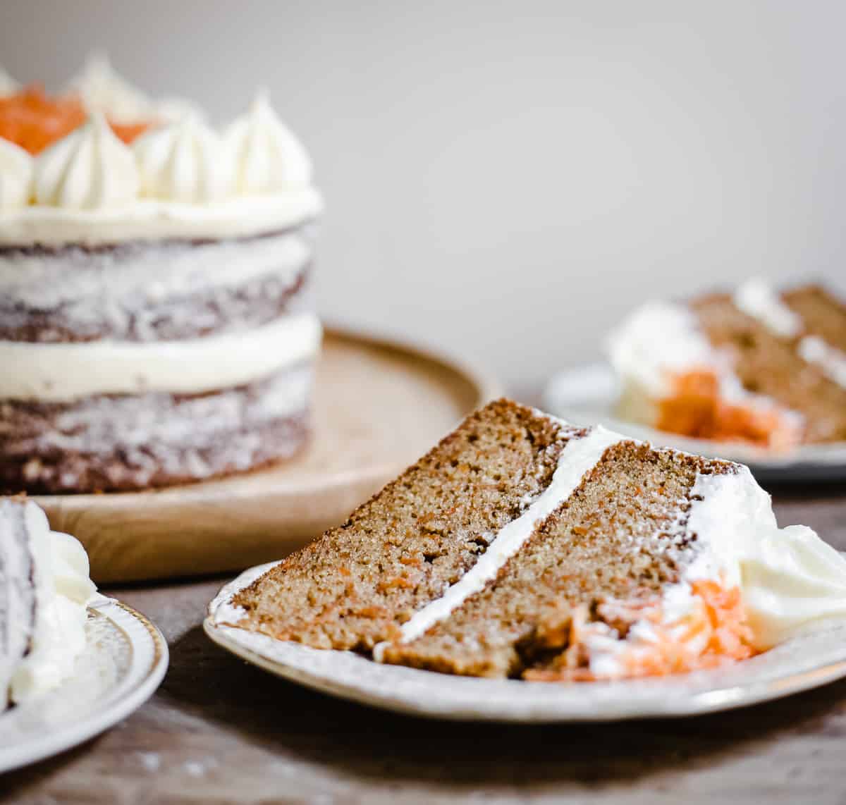 A slice of gluten-free carrot cake on a plate