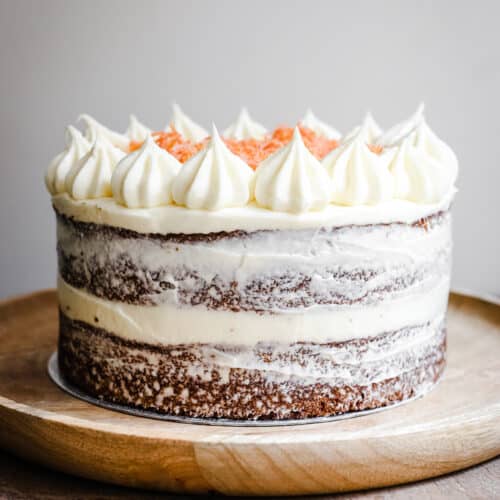 gluten-free carrot cake on a wooden plate on a table