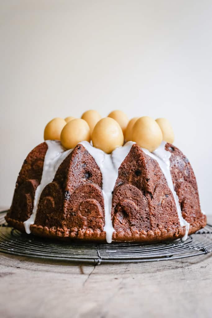 Simnel Cake on a wire rack on a wooden board