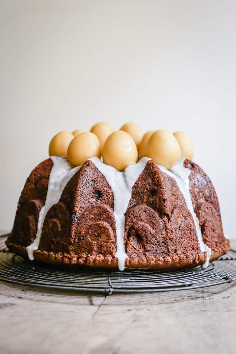 Simnel Cake on a wire rack on a wooden board