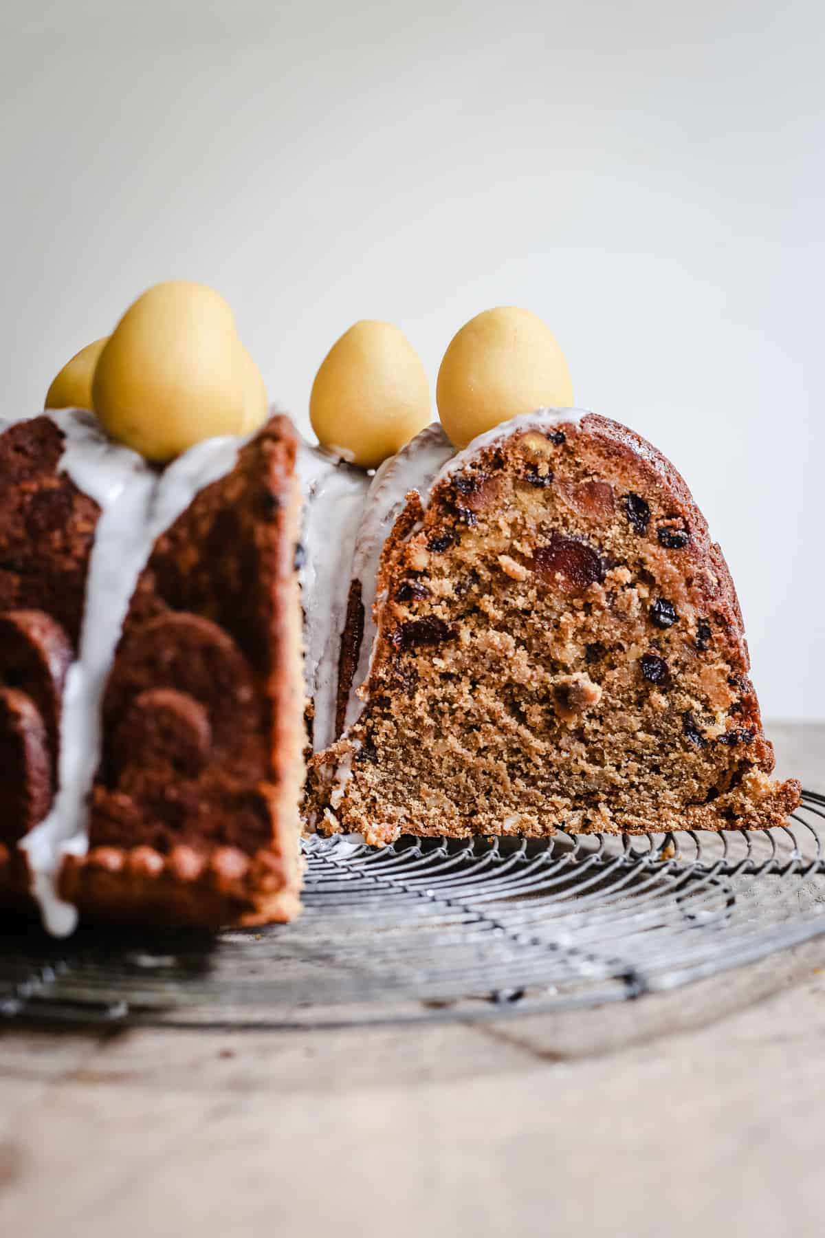 Simnel Cake on a wire rack on a wooden board