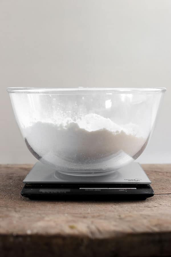 flour in a mixing bowl on a set of scales