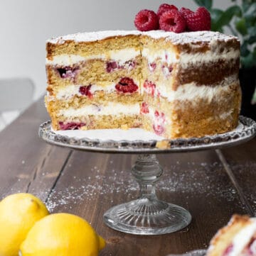 Cut Lemon Raspberry Cake on a cake stand