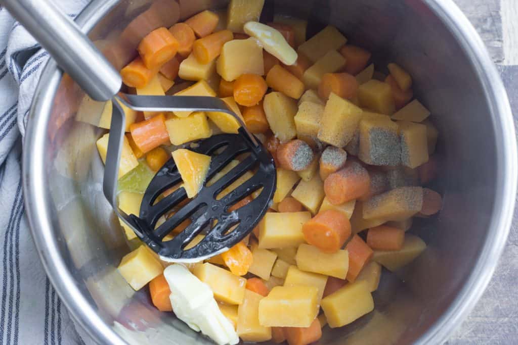 Carrot and Swede being mashed in the Instant Pot