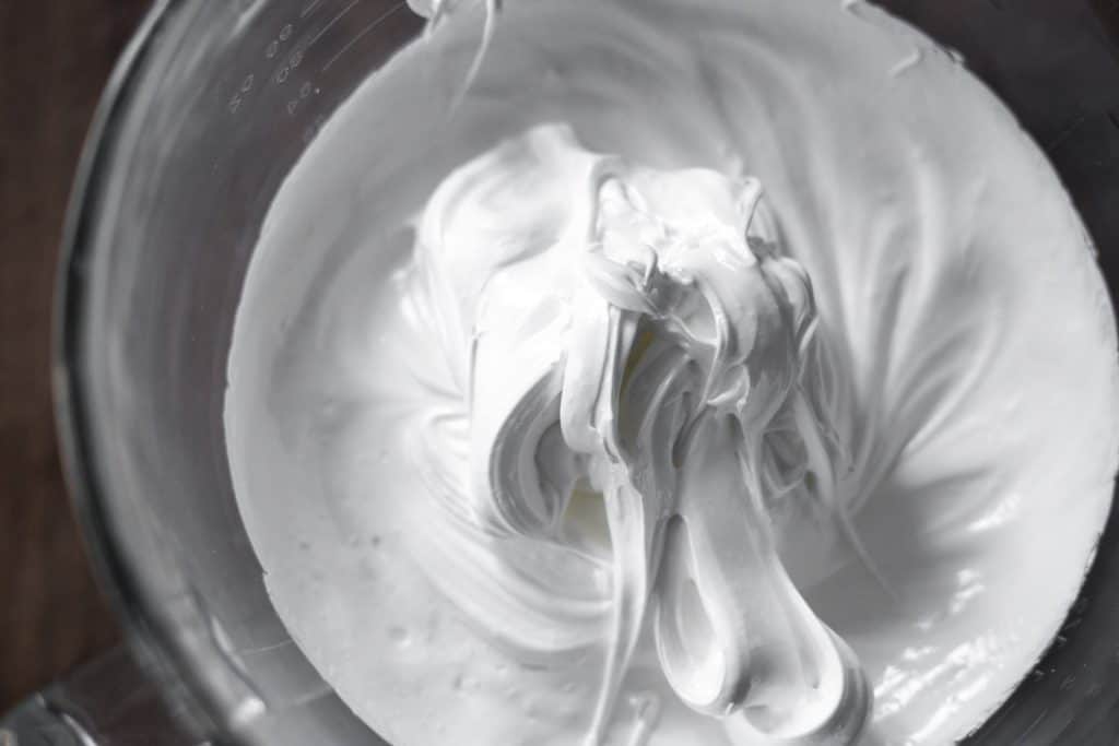 close up of whipped swiss meringue in a bowl