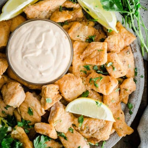 Salmon Nuggets on a plate with dipping sauce