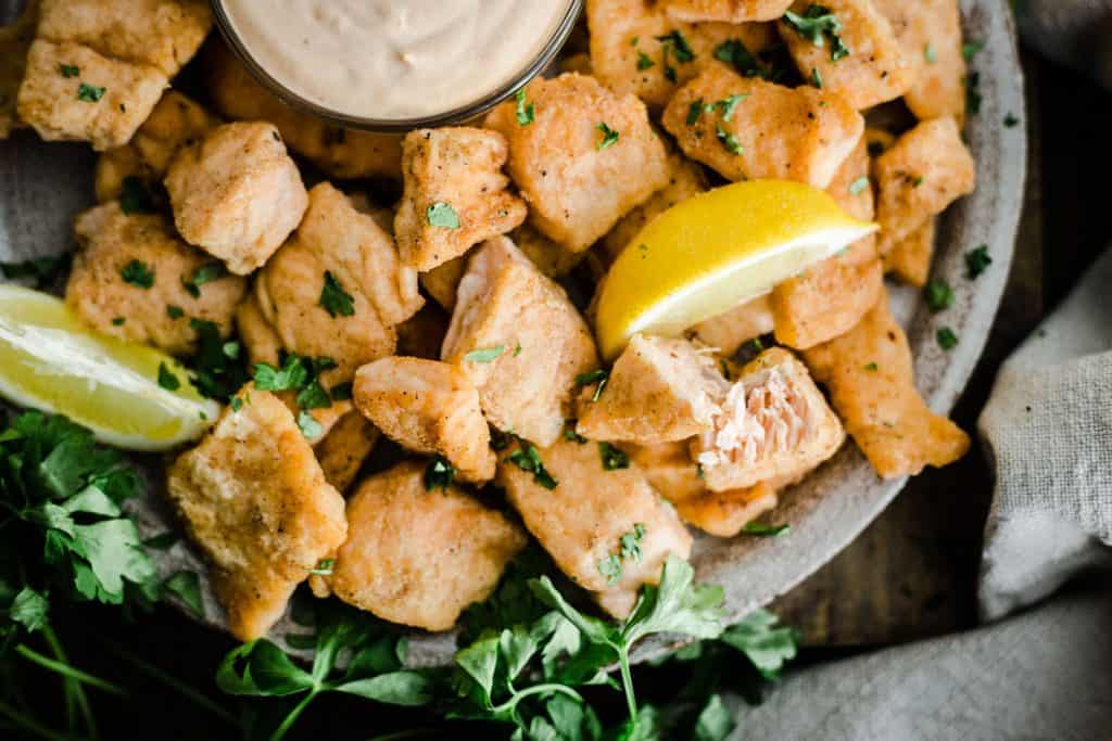 Salmon Nuggets on a plate with dipping sauce